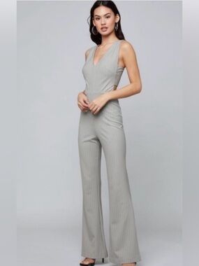 BEBE mitered light grey pinstripe side cutout flare leg jumpsuit Size 6